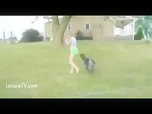 Girl playing with dog